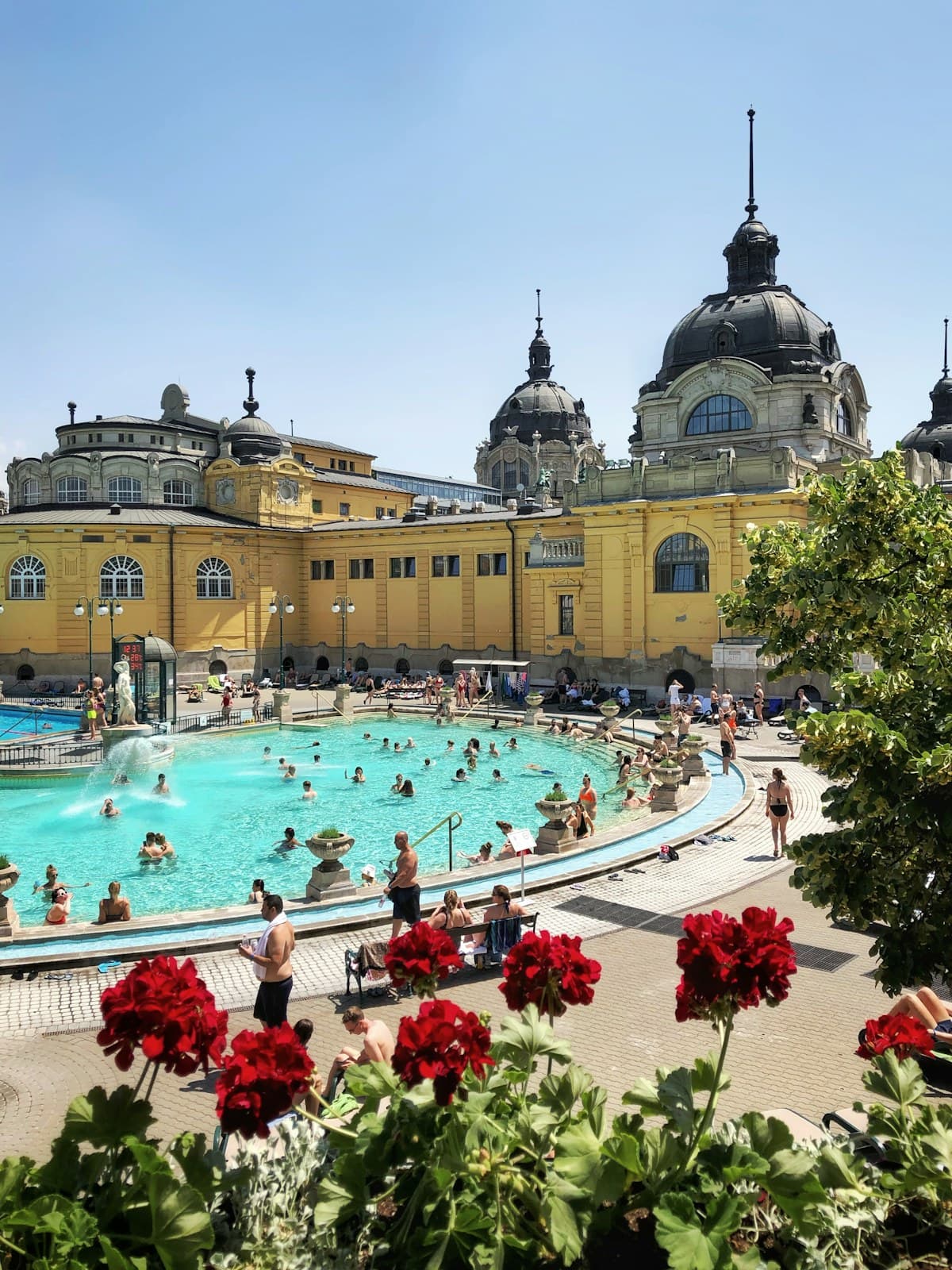 The main outdoor pool at Szechenyi Thermal Bath in Budapest, surrounded by its Neo-Baroque building